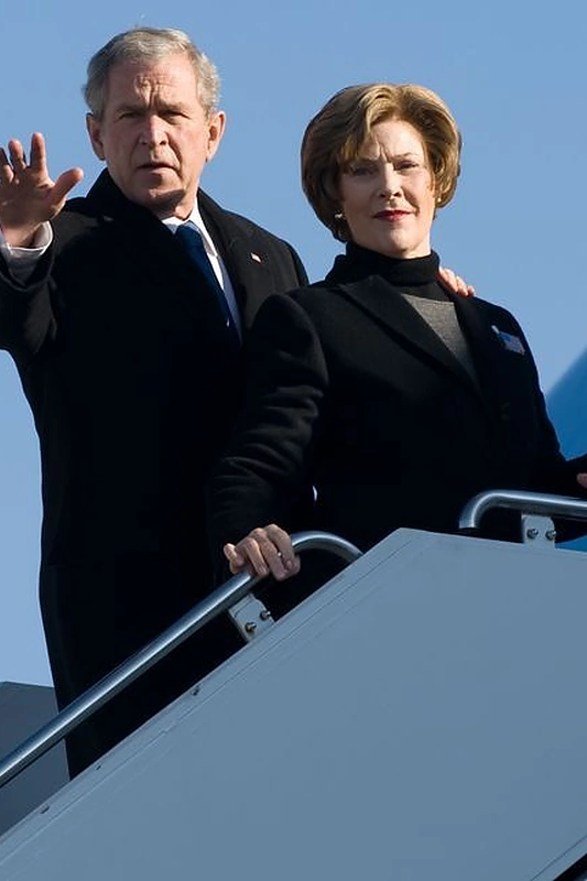 JAV prezidentas Georgas W. Bushas su žmona Laura Bush / AFP/„Scanpix“ nuotr.