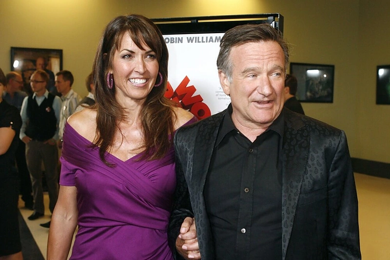 Robinas Williamsas su trečiąja žmona Susan Schneider (2009 m.)