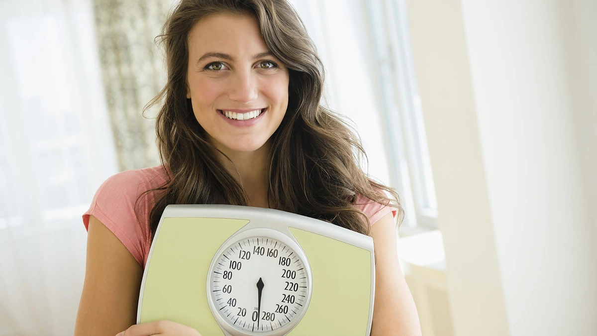 Moteris su svarstyklėmis