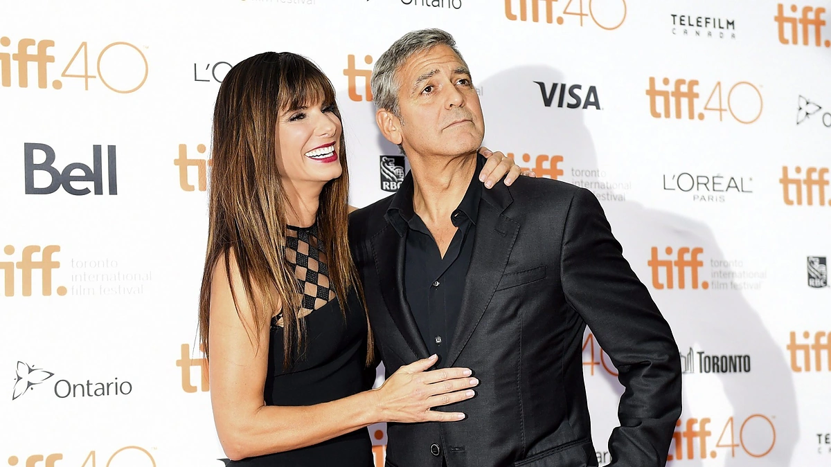 Sandra Bullock ir George'as Clooney