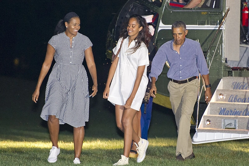 Barackas ir Michelle Obamos su dukra Malia