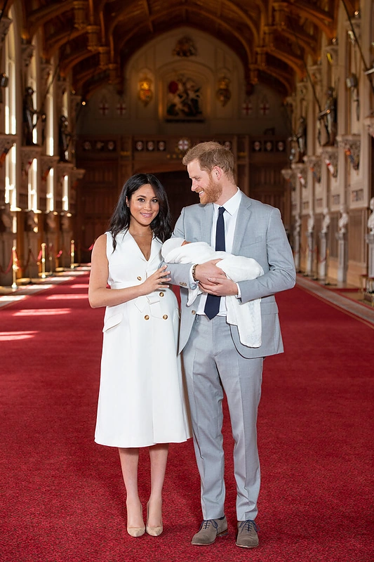 Meghan Markle ir princas Harry su mažyliu / „Scanpix“ nuotr.