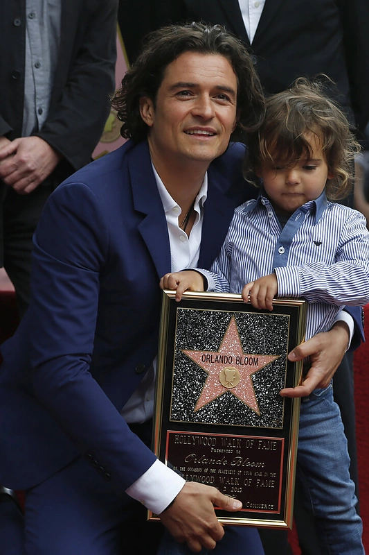 Orlando Bloomas su sūnumi Flynnu (2014 m.) / „Scanpix“ nuotr.