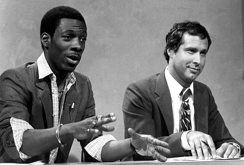 Eddie Murphy ir Chevy Chase'as laidoje „Saturday Night Live“ 1981 m. / Vida Press nuotr.