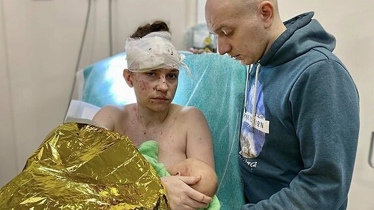 Ukrainietė Olga, savo kūdikį apsaugojusi per apšaudymą / Socialinių tinklų nuotr.