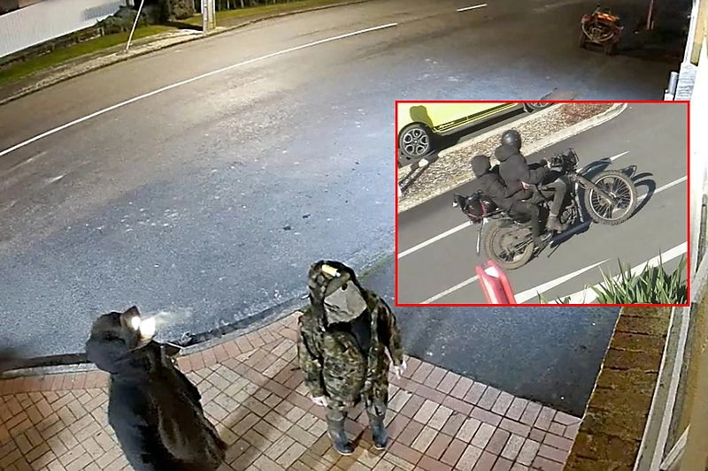 Tomas Phillipsas ir vienas iš jo vaikų / AFP/Scanpix/Stopkadras